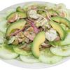 Our aguachiles is a plate of cucumbers, avocado, onions, and shrimp marinated in a very spicy salsa.
